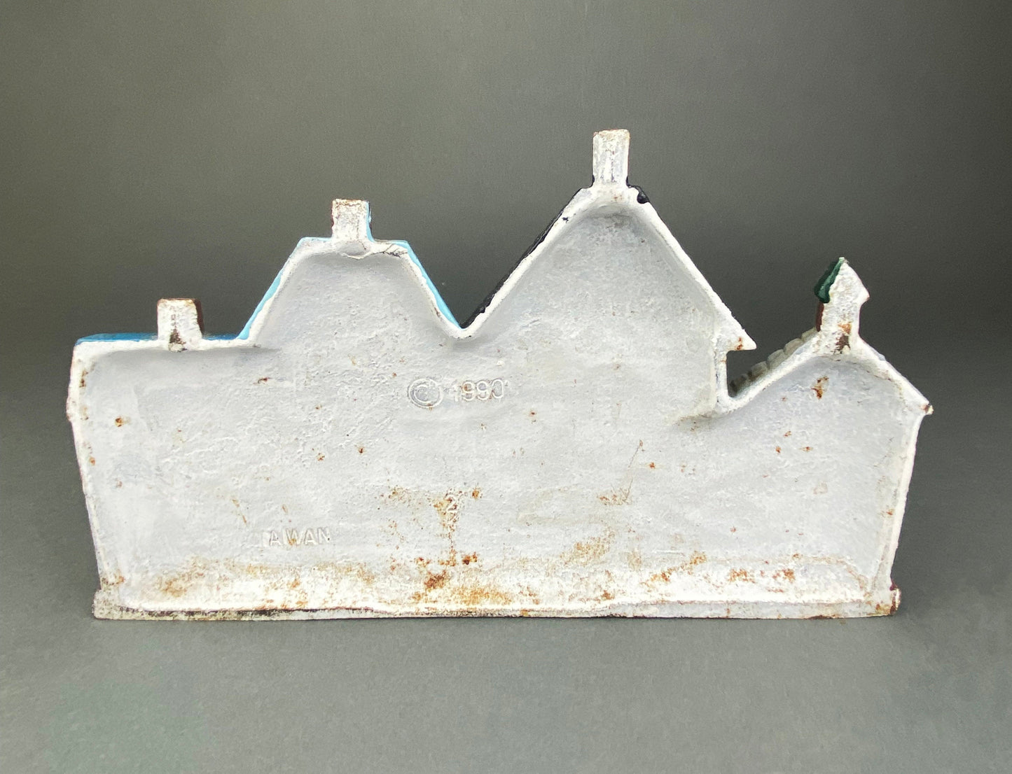 Vintage Cast Iron Door Stopper Shaped like Row of Houses