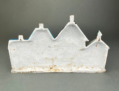 Vintage Cast Iron Door Stopper Shaped like Row of Houses