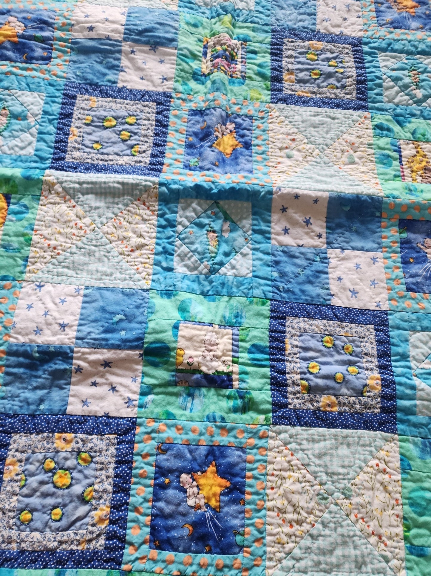 Homemade baby quilt in blues greens and Yellows baby's riding stars. - I Bought a Yard Sale