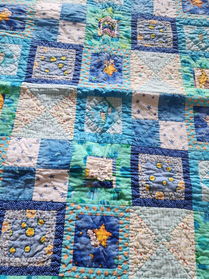 Homemade baby quilt in blues greens and Yellows baby's riding stars. - I Bought a Yard Sale