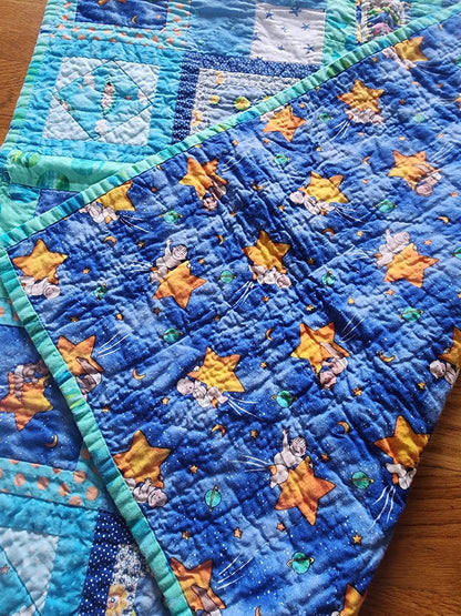 Homemade baby quilt in blues greens and Yellows baby's riding stars. - I Bought a Yard Sale