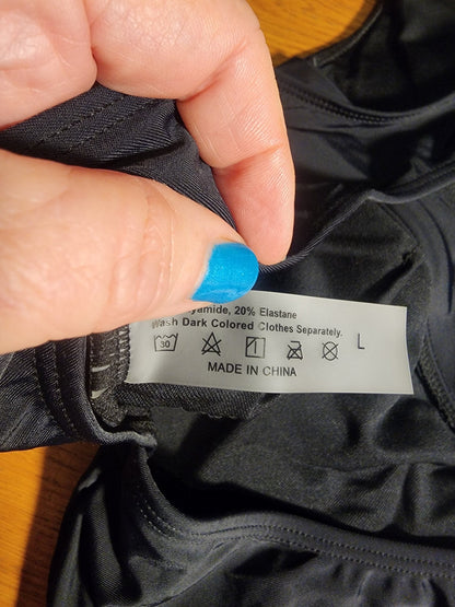 Sleek and stylish black one - piece swimsuit, perfect for the beach or pool L - I Bought a Yard Sale