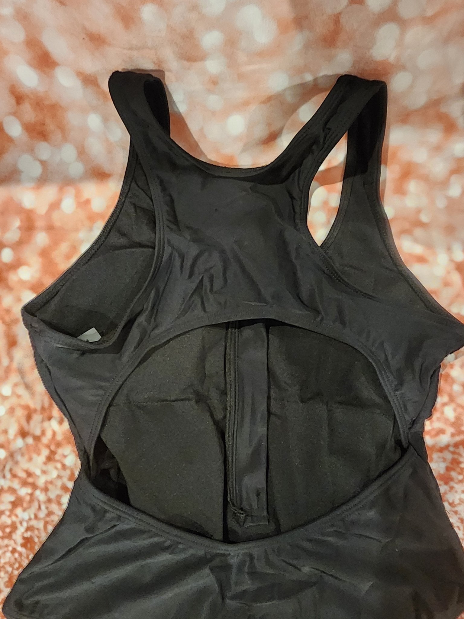 Sleek and stylish black one - piece swimsuit, perfect for the beach or pool L - I Bought a Yard Sale