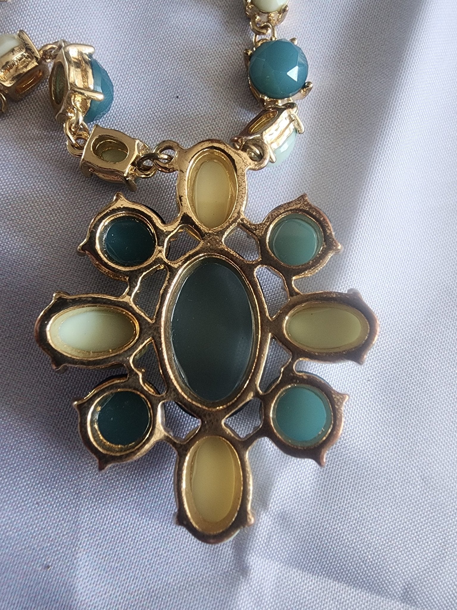This vintage necklace features a stunning cluster of teal and cream stones - I Bought a Yard Sale